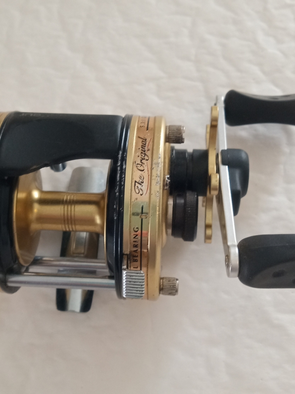 Gold and Black Round Baitcasting Reel - The Original Series